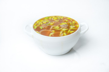 food soup in a white plate on a white background