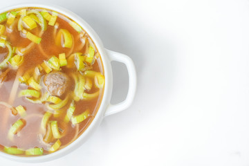 food soup in a white plate on a white background