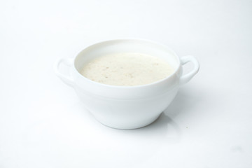 food soup in a white plate on a white background