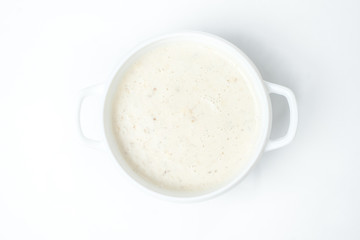 food soup in a white plate on a white background