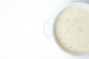 food soup in a white plate on a white background