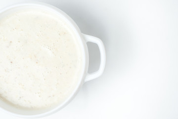food soup in a white plate on a white background