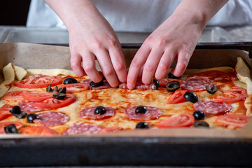 Girl making pizza