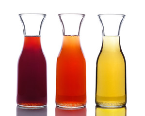 Three Carafes of wine - one red and one white and one blush or rose, isolated on white.