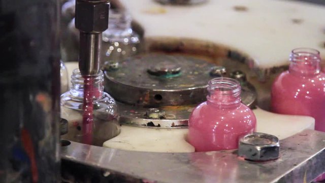 Acrylic Paint Bottle Machine Filling Pink Paint in Factory
