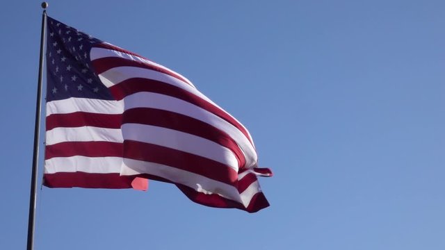 United State of America Flag Blowing in the Wind on a Clear, Blue, Sunny Day; Slow Motion 120fps