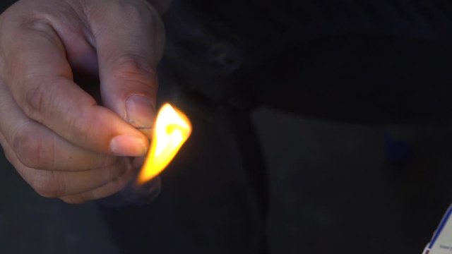 Close Up of Man striking a match in Slow Motion
