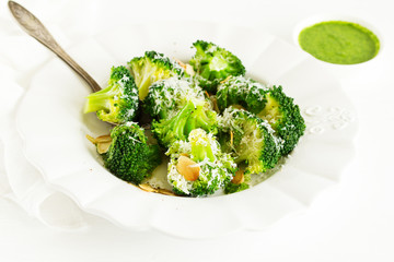 Broccoli cabbage with garlic and cheese with green sauce.