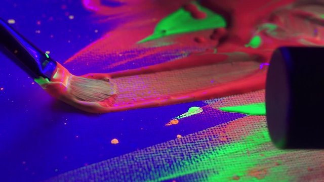 Close Up of Paint brush and Neon Glow in the Dark Acrylic Paint