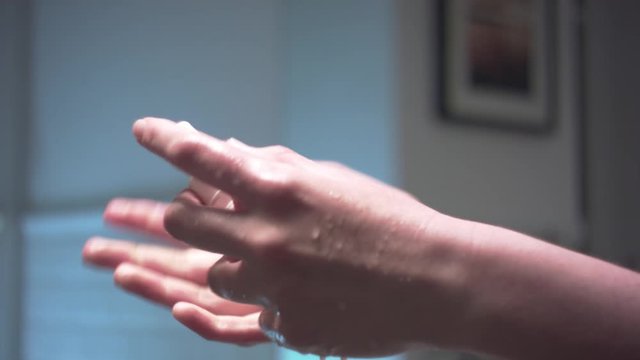 Hands disinfection in beautiful bathroom. Professional lighting. Arri Xenon lens. Water is turned off during the process. 
