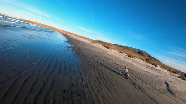 Cinematic Race Drone Captures Unique FPV Aerial Chase Footage of Motorcycle on Beach at 60 FPS 60FPS Slow Motion