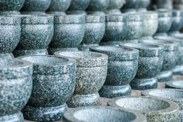 Fototapeta premium Stone mortars lined up in front of the Angsila shop. Chonburi Province
