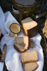 military mug, bread lie on a white towel