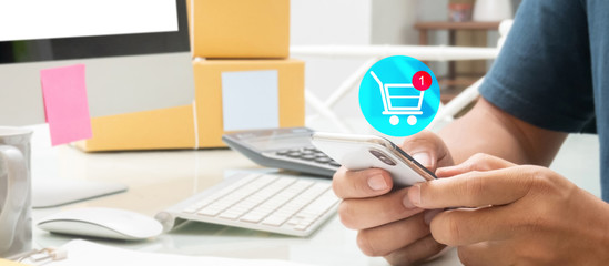 close up of Asian  business man with hologram internet online shopping basket with purchase item using touch screen system work from home with online business  e-commerce global delivery concept