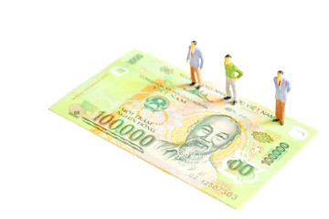 the miniature standing on dong bank note isolate on white background.