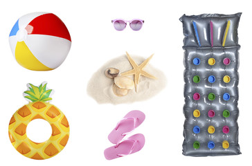 Set of different beach accessories on white background, top view
