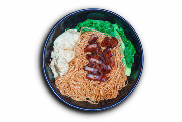 Traditional Chinese wantan mee noodle  served with char siew braised pork and cabbage on dark wooden table