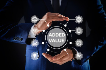 Businessman demonstrating directions of added values on black background, closeup