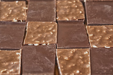 pieces of different milk chocolate are carefully laid out in a staggered order