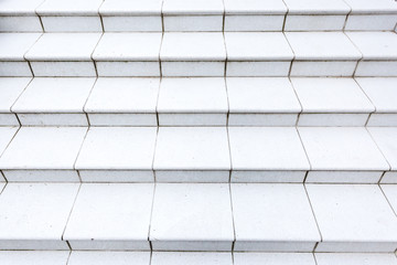 Stone granite white stairs. Textured background. Close up image.