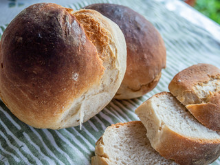 Freshly baked sliced bread on the table closeup.