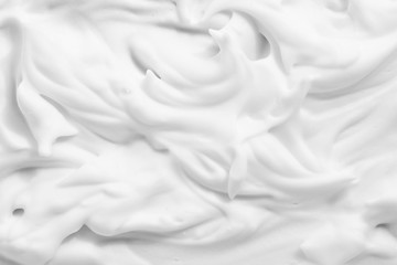 White cream foam texture background. Cosmetic mousse, cleanser, shaving foam, shampoo lather. Foamy skin care product close up. - obrazy, fototapety, plakaty