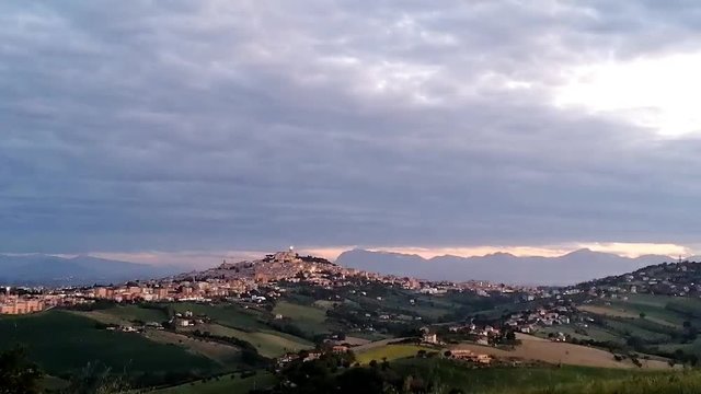 Time lapse in Italy, Fermo, hills with sun and clouds