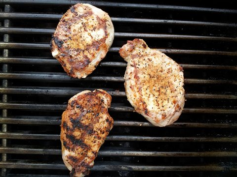 Directly Above Shot Of Pork On Barbecue Grill