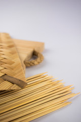 Arranging decoration of satay meat. The concept of bamboo material equipment with a white space background.