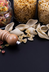 Glass bottles full of pasta.