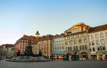 Fototapeta na wymiar Main square in Graz, with a clock tower behind it