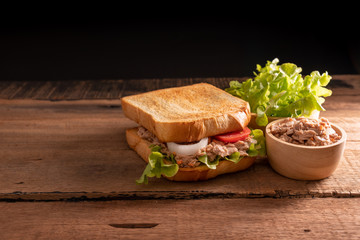 Sandwich Tuna with bread toast filling from lettuce, tomato.