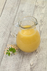 Dietary vegetarian oats milk over wooden