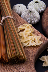 Sea urchin shells, linguine and farfalle pasta.