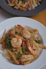 Rice topped with stir-fried pork shrimp bamboo shoot and basil