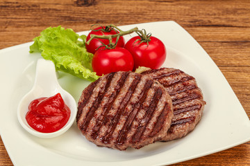 Grilled burger cutlet with sauce