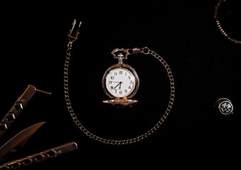vintage pocket watch on black