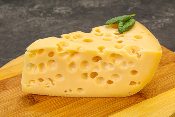 Maasdam cheese - yellow triangle with holes