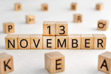 November 13 - from wooden blocks with letters, important date concept, white background random...