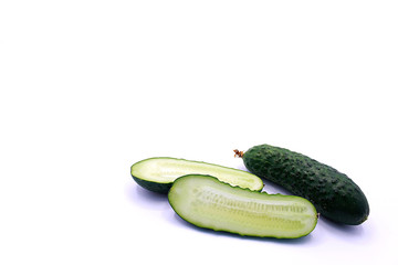 Photo of young cucumbers on a white background, close-up