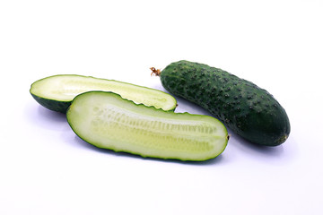 Photo of young cucumbers on a white background, close-up