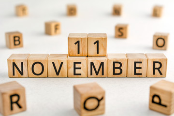 November 11 - from wooden blocks with letters, important date concept, white background random...