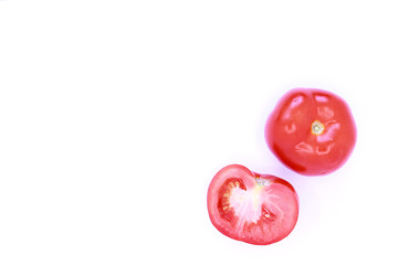 Photo of red tomatoes on a white background, close-up
