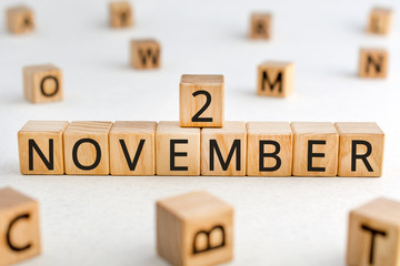 November 2 - from wooden blocks with letters, important date concept, white background random...