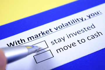 Obraz premium With market volatility, you: stay invested or move to cash?