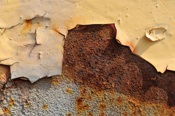 An example of using primer paint for rust. Peeling off old paint. Corrosion of metal.