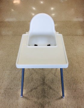 High Angle View Of Empty High Chair On Floor