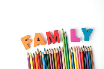 ' FAMILY ' Multicolored Wooden Letters, Color Pencil Instead ' I ' Letter with Multicolored Pencil on White Background    