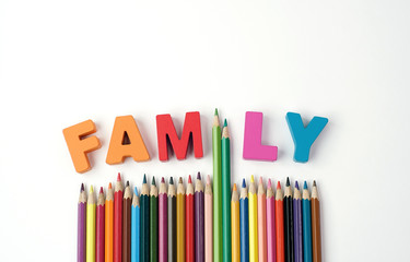' FAMILY '  Wooden Letters, Color Pencil Instead ' I ' Letter with Multicolored Pencil on White Background, Words for Leaning                                       