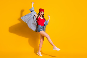 Full length body size view of her she nice attractive slender glamorous cheerful cheery glad wavy-haired girl dancing enjoying having fun isolated on bright vivid shine vibrant yellow color background